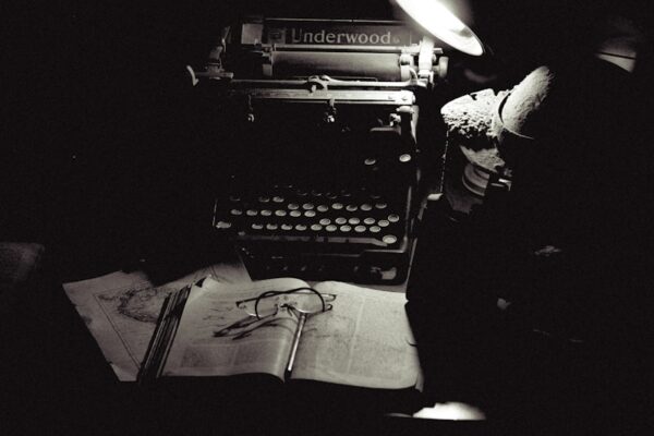 A black and white photo of an old typewriter