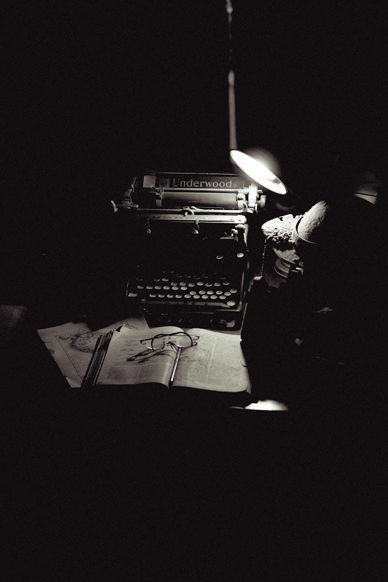 A black and white photo of an old typewriter